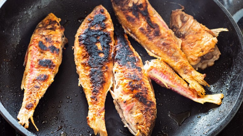 burnt fish in skillet