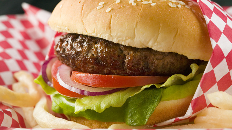 Burger in paper sleeve