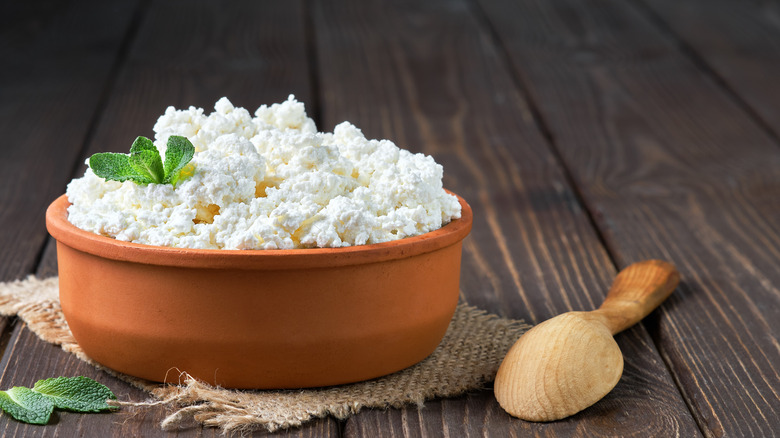 bowl of cottage cheese with wooden spoon