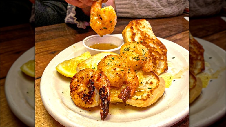 grilled shrimp on plate with side of melted butter